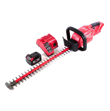 Cortasetos a batería Milwaukee M18 CHT-501C 18 V 610 mm sin escobillas + 1x batería 5,0 Ah + cargador